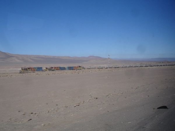 Train running through the desert