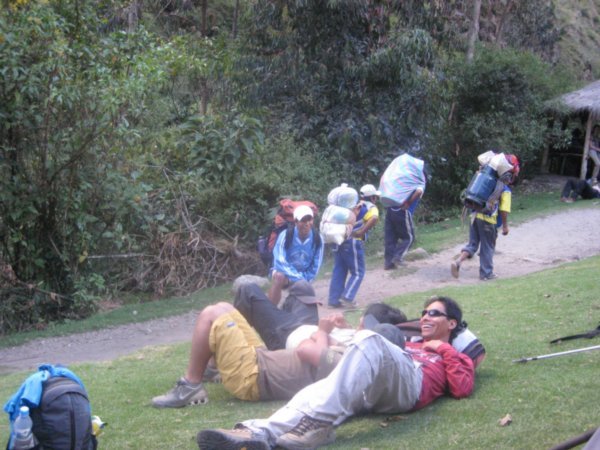 The guides having a rest, while the porters do all the work