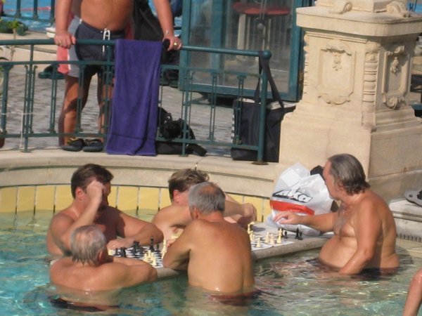 Intense mid-pool game of chess taking place