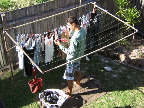Kris hanging Bella's pink underwear on the line.