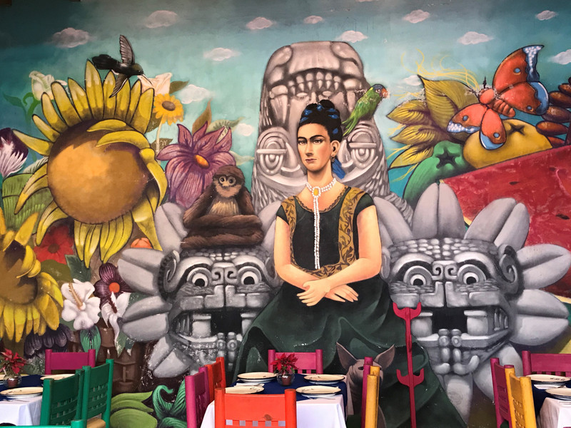 Frida painting in restaurant. 