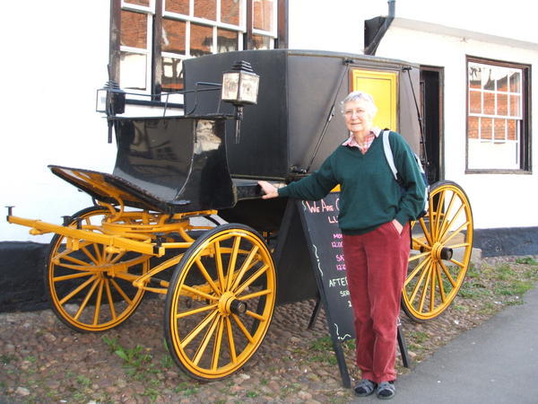 Beatrice with old horse carriage Photo