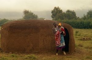 Maasai Woman and Maasai Home