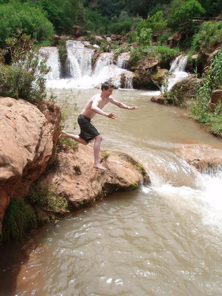 Brendan jumps into the falls