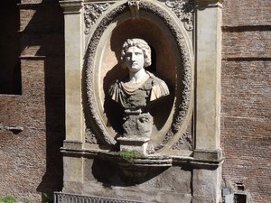 Bust on Roman wall 