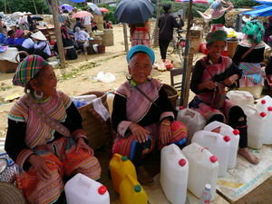 Flower Hmong women selling Maize whiskey