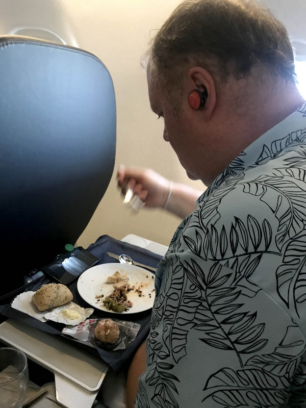 Enjoying some dinner on the plane