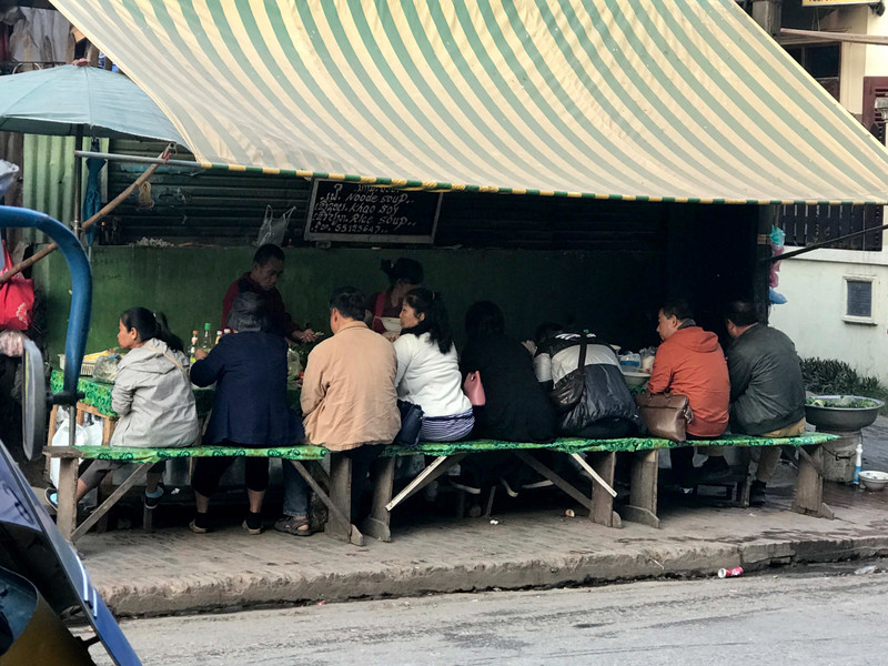 Locals eating breakfast at local cafe