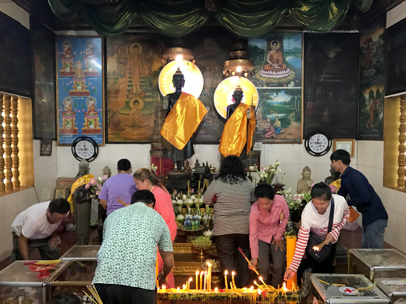 Many people giving offerings