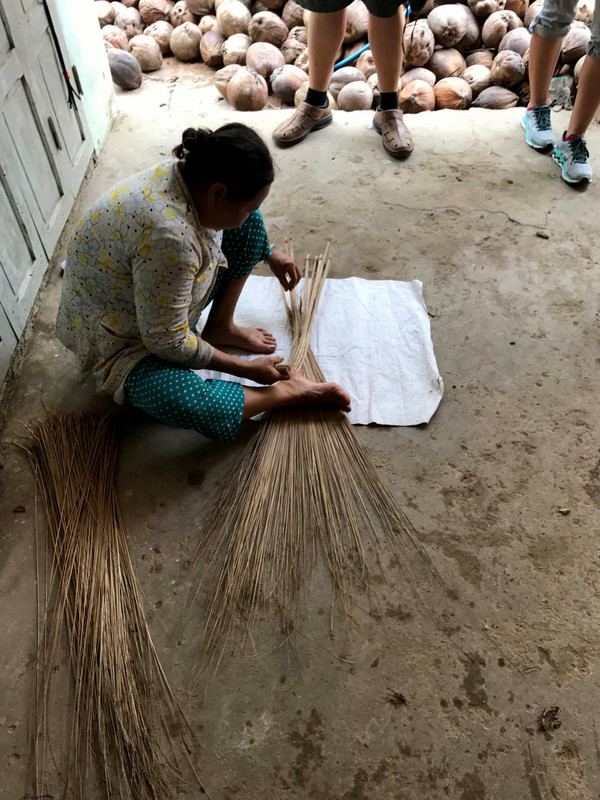 Woman making a broom