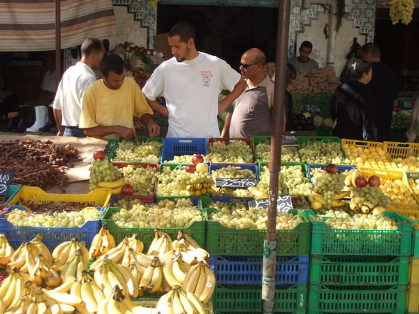 streets were packed full of fresh produce for sale and heaps of junk