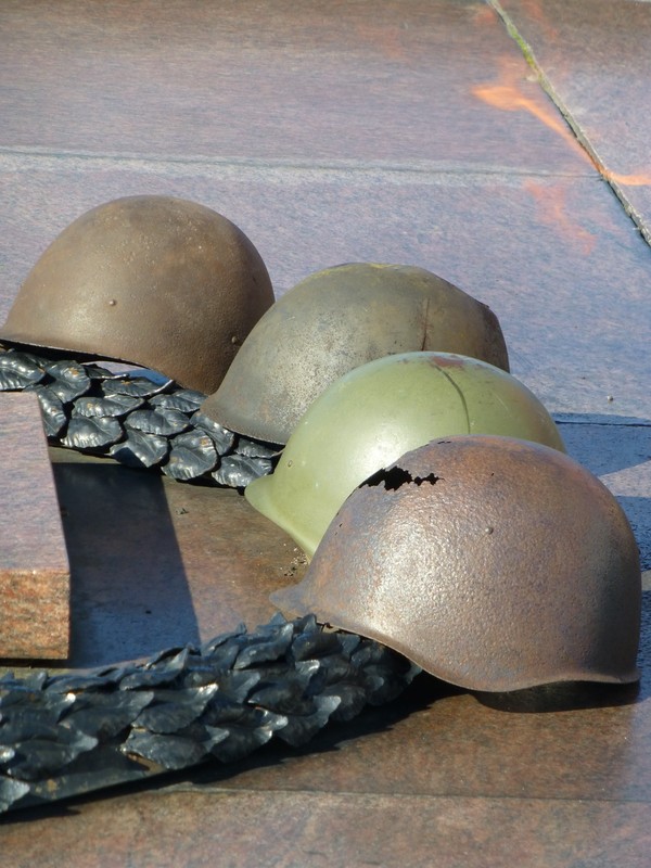 Helmets at the eternal flame.
