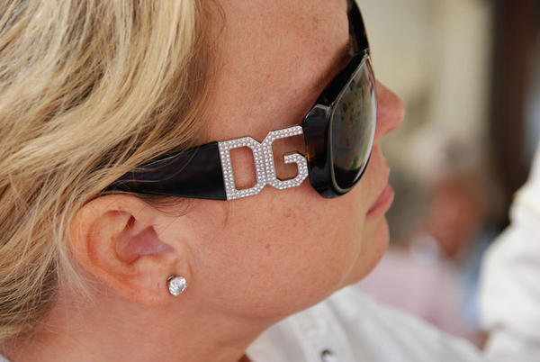 Melinda wants you to notice the DG on her glasses.