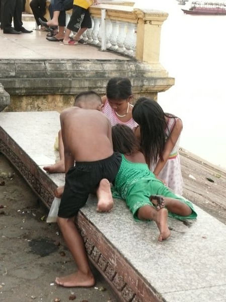 children playing by the river