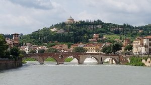 View of hill behind Adige River and Ponte Pietra.