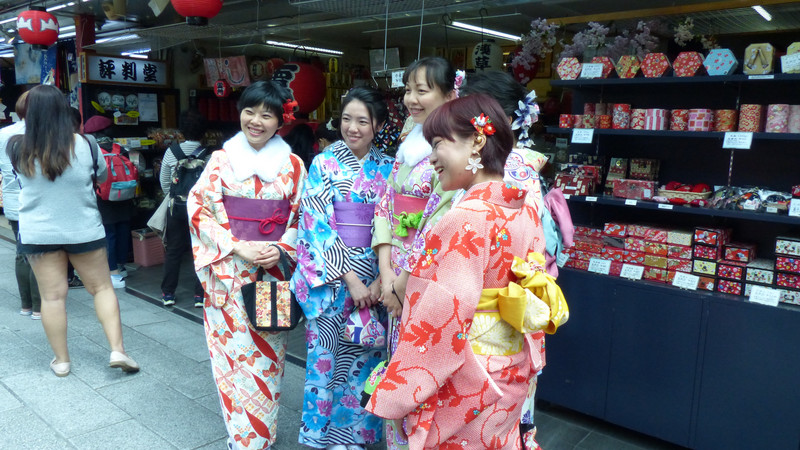 ASIAN VISITORS DRESSED IN TRADITIONAL DRESS