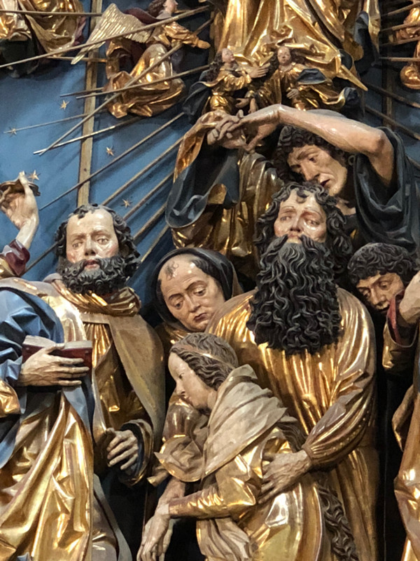 SEVERAL OF THE FIGURES ON THE ALTARPIECE
