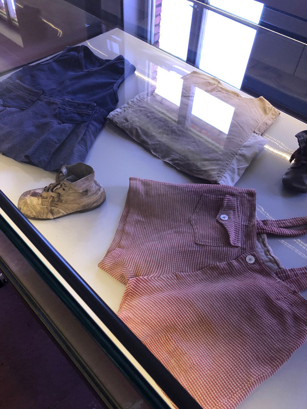 CHILDRENS CLOTHES ON DISPLAY FROM PRISONERS