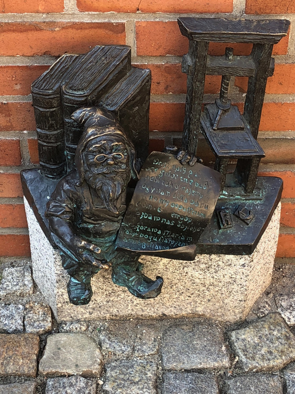 ONE OF THE LITTLE BRONZE GNOMES COMMEMORATING THE PRINTING OF THE FIRST BOOK IN WROCLAW