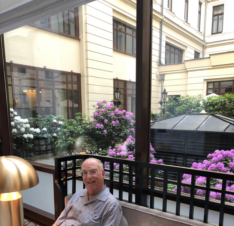 DENNIS SITTING IN FRONT OF THE INDOOR COURTYARD