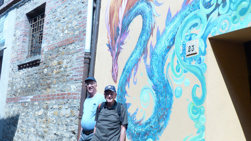 DENNIS AND RON IN FRONT OF A WALL MURAL