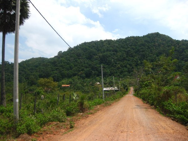 Our bungalow was halfway up this hill on the left (in the jungle)
