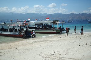 Locals pushing the boat off from Gili T! 