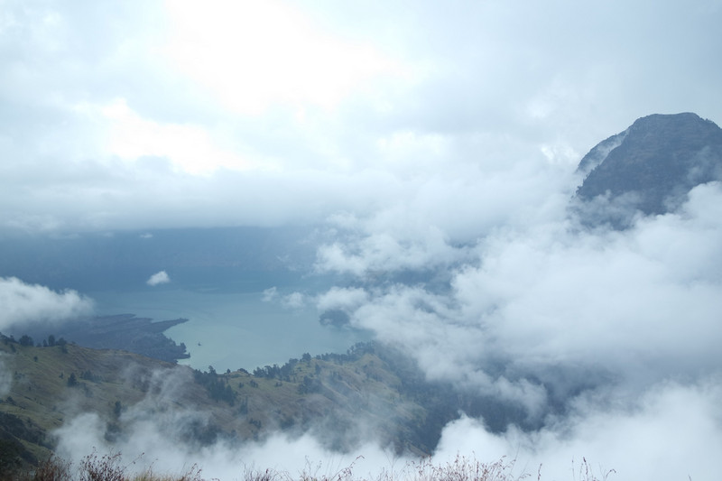 A brief view of the crater lake between the clouds 