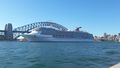 A cruise ship pulling out of the Harbour - dwarfing the bridge 