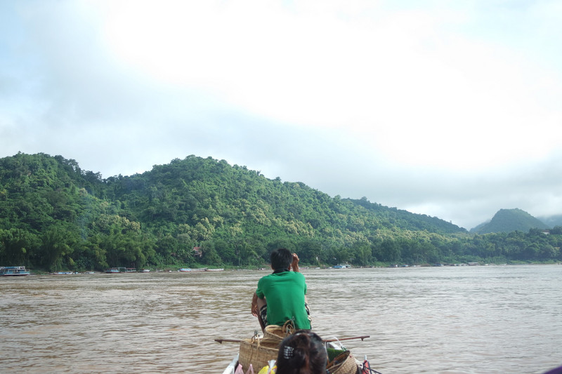 Crossing the Mekong River by local taxi boat 