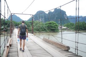 Walking the main bridge over the Nam Song River, Vang Vieng 