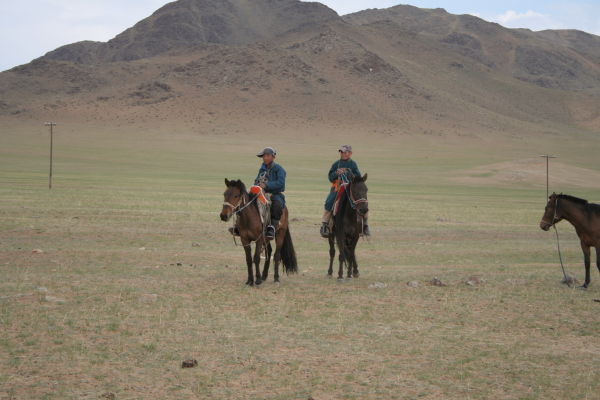 Nomadic boys on horseback