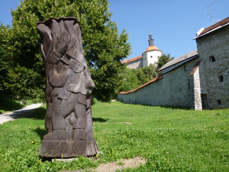 Wooden carving with castle in background