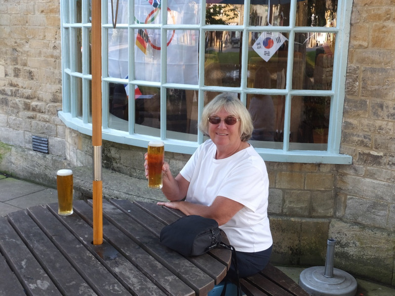 Stacy having a pint in Borton-on-the-Water