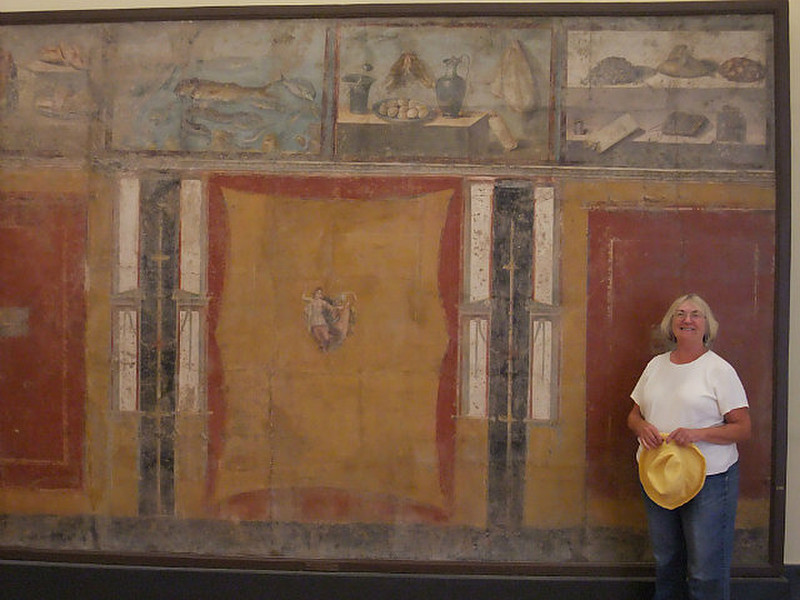 Stacy next to a 500BC painted mural