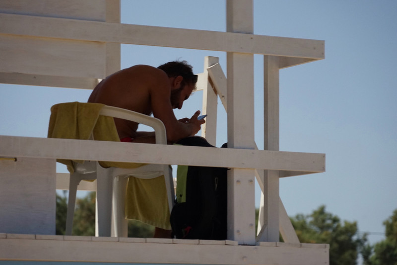Lifeguard hard at work, Legendary Iguana Beach