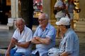 Corfiotes deep in conversation, Corfu Town