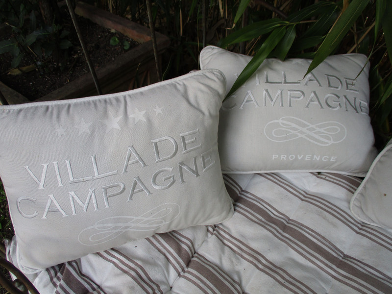 Pillows on villa's garden bed