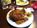 Grilled pork knuckle, kraut and fried potatoes
