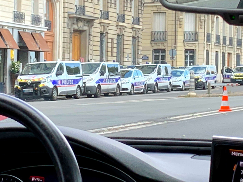 Police cars staged near the river