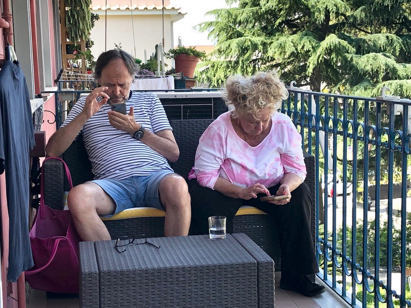 Cell phone addicts on the balcony