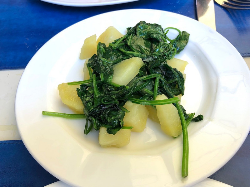Boiled potatoes with spinach