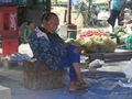 Lady sleeping at the market
