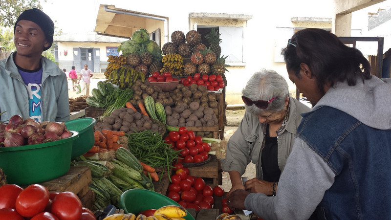 Hasina,right, our driver helps at Market A