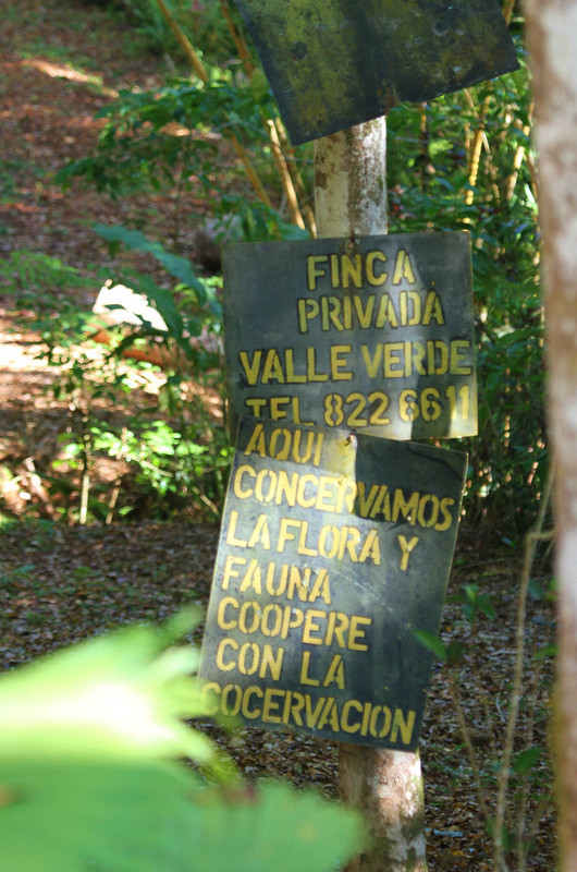 signs for farm on hillside