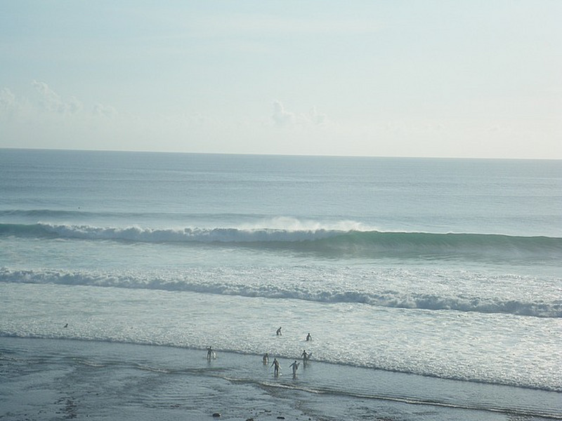 Surfers Entering the Waves at Uluwatu