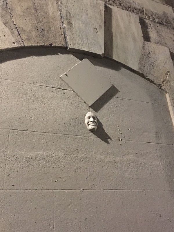 Funny heads sticking out of walls