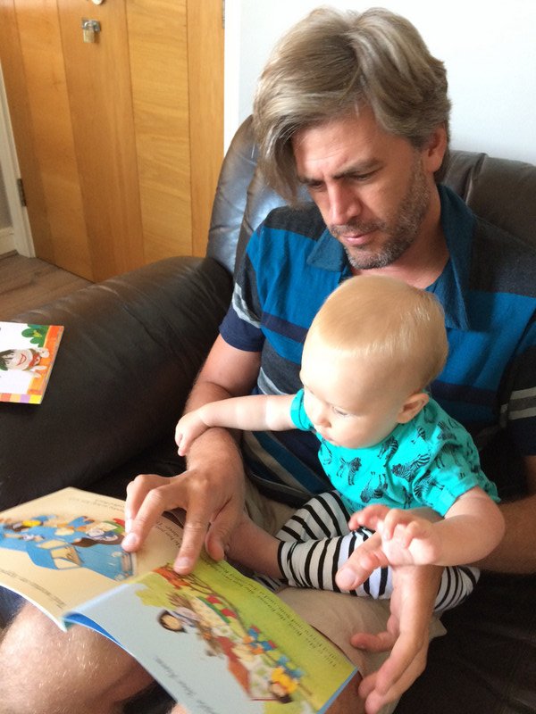 Daddy reading books to me