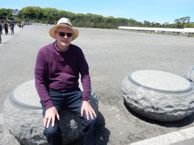 Stefan rests on an elegant granite bollard