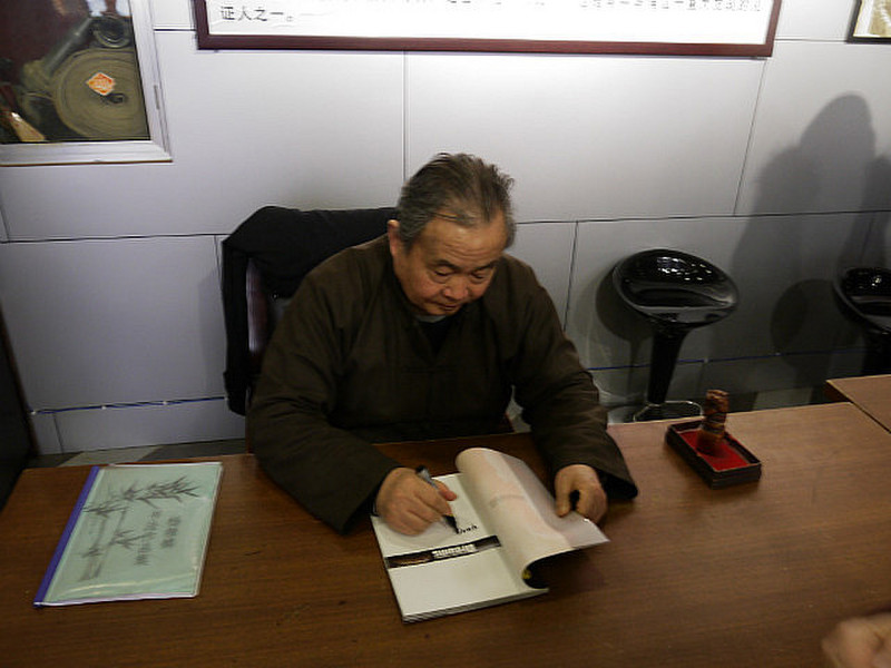 Farmer signing our book